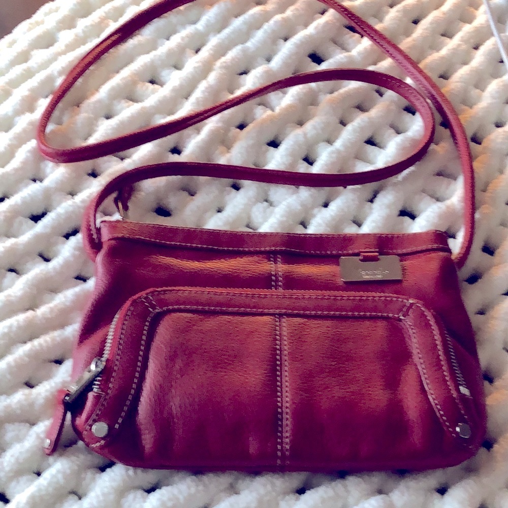 Tignanello leather, red pebbled crossbody. Silver studs and hardware. No flaws.